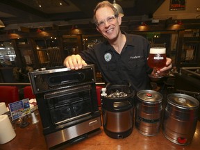 George Dyke and his PicoBrew craft beer brewing machine at Louis Cifer pub on the Danforth on Tuesday May 2, 2017. (Jack Boland/Toronto Sun)