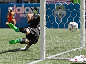 Former Reds goalkeeper Stefan Frei can’t stop a Jozy Altidore penalty kick. It was the only goal TFC needed for a big road win. AP