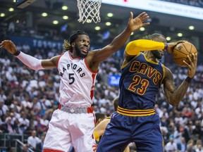 Raptors' DeMarre Carroll (left) defends against Cavaliers' LeBron James during first half NBA playoff action in Game 3 of the Eastern Conference semifinals at the Air Canada Centre in Toronto on Friday, May 5, 2017. (Ernest Doroszuk/Toronto Sun)