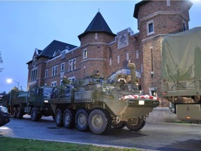 Passersby cheered as army vehicles enter the Hull Regiment on Saturday evening May 6, 2017, from CFB Valcartier near Quebec City