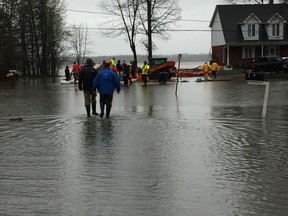 Ottawa Mayor Jim Watson and Coun. Eli El-Chantiry make their way down flooded Moorhead Drive in the Willola Beach area on Saturday, May 6, 2017.