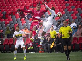 Tampa Bay Rowdies player Damion Lowe battles Ottawa Fury FC’s Steevan Dos Santos yesterday at TD Place. Ashley Fraser/Postmedia Network