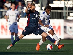 C Edmonton midfielder Allan Zebie, right, is challenged by, Indy Eleven midfielder Brad Ring for the ball in North American Soccer League play on Saturday, May 6, 2017 in Indianapolis, Indiana. The game ended in a 0-0 tie.