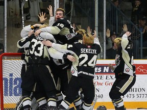 Trenton players whoop it up at the final buzzer after the Golden Hawks defeated the Georgetown Raiders 2-1 in the Dudley Hewitt Cup final Saturday night at Community Gardens. (Alex D'Addese/OJHL Images)
