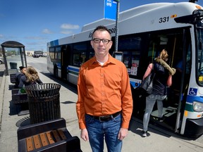 Shawn Lewis, who chairs the Argyle Community Association, stands at the bus stop at Argyle Mall, where the group is asking city councillors to locate the east-end BRT ?transit village,? rather than at Fanshawe College. The association suggests Fanshawe could be served from the mall by a dedicated bus. (MORRIS LAMONT, The London Free Press)