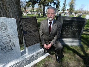 Irwin Kumka from the Historic Kildonan Church and Cemetery Inc., poses next to a new gravestone and memorial to honour the life of Lt. Alan Arnett McLeod V.C. on Sun., May 7, 2017. A commemoration will take place at McLeod's grave site on Tuesday. Kevin King/Winnipeg Sun/Postmedia Network