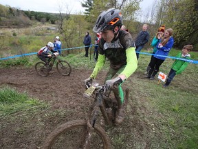 Brendan Laughlin and Kim Haagmans-Hawke crest the top of the final climb of the second round of the Ontario Cup Mountain Bike Series in Kingston, Ont. on Sunday, May 7, 2017.