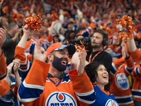 Fans of the Edmonton Oilers, cheer one of the seven goals scored against  the Anaheim Ducks in Game 6 in the second round of NHL playoffs at Rogers Place on May 7, 2017. Photo by Shaughn Butts / Postmedia