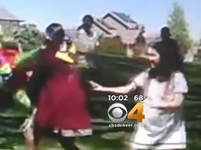 A screen grab from CBS Denver shows students appearing to smack a pinata with Trump's face on it.