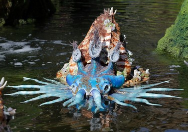 In this Saturday, April 29, 2017 photo, a water creature floats in a pond at Pandora-World of Avatar land attraction in Disney's Animal Kingdom theme park at Walt Disney World in Lake Buena Vista, Fla. The 12-acre land, inspired by the “Avatar” movie, opens in Florida at the end of May at Walt Disney World’s Animal Kingdom. It cost a half-billion dollars. (AP Photo/John Raoux)