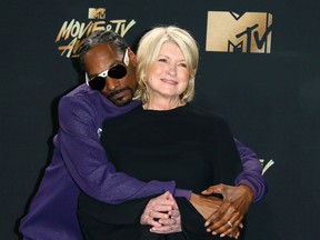 Snoop Dogg (L) and Martha Stewart pose in the press room during the 2017 MTV Movie & TV Awards at the Shrine Auditorium, in Los Angeles, California, on May 7, 2017. / AFP PHOTO / JEAN-BAPTISTE LACROIXJEAN-BAPTISTE LACROIX/AFP/Getty Images