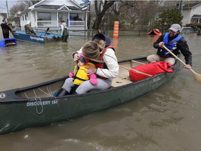 Hundreds of more people were evacuated from their homes in Gatineau Sunday May 7, 2017. Families used boats to keep their valuables safe and dry Sunday. (TONY CALDWELL / POSTMEDIA NETWORK)