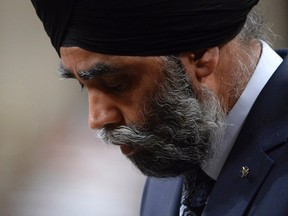Defence Minister Harjit Sajjan bows his head during question period in the House of Commons on Parliament Hill in Ottawa on Tuesday, May 2, 2017. THE CANADIAN PRESS/Adrian Wyld