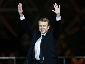 French President-elect Emmanuel Macron gestures during a victory celebration outside the Louvre museum in Paris, France, on Sunday, May 7, 2017. (AP Photo/Thibault Camus)