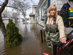 Mary Courneyea at her house on Rue Saint-Patrice in Gatineau which is now unreachable by car. WAYNE CUDDINGTON /POSTMEDIA