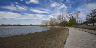 Water edges towards the boardwalk at a flooded Woodbine Beach in Toronto, Ont. on Monday May 8, 2017. (Ernest Doroszuk/Toronto Sun)