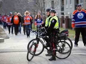 Edmonton Police watch as Oilers fans arrive at Rogers Place during the Oilers' playoff run in Edmonton Thursday April 20, 2017. Photo by David Bloom