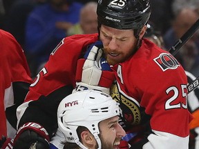 Ottawa Senators' Chris Neil tussles with New York Rangers' Tanner Glass during Game 6 on May 6, 2017. (Tony Caldwell/Postmedia)