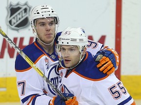 Edmonton Oilers center Mark Letestu, right, is hugged by Connor McDavid after scoring against the Winnipeg Jets in Winnipeg on Dec. 1, 2016. (Brian Donogh)