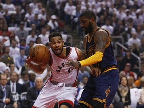 Raptors guard Cory Joseph (left) tries to get past Cavaliers’ Kyrie Irving during Game 4 on Sunday. Joseph has one year remaining on his contract before he can opt out in search of a new long-term deal either in Toronto or elsewhere. (Jack Boland/Toronto Sun)