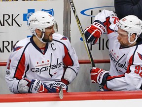 Washington Capitals' Alex Ovechkin and Evgeny Kuznetsov celebrate on the bench in the final seconds of a 5-2 win over the Pittsburgh Penguins in Game 6 on May 8, 2017. (AP Photo/Gene J. Puskar)