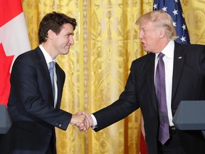 Canadian Prime Minister Justin Trudeau (left) and U.S. President Donald Trump shake hands during a joint news conference in the East Room of the White House in Washington on Feb. 13, 2017. (AP Photo/Pablo Martinez Monsivais)