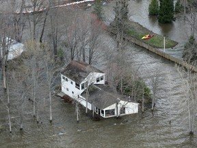 CONSTANCE BAY AREA, where one home is totally stranded by water.