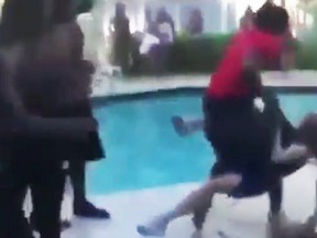 Video shows a teen tossing an elderly woman into a pool after she approached them to turn down their music.