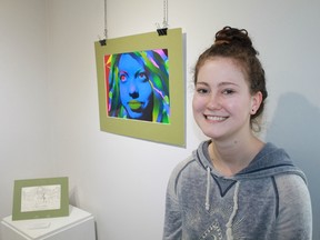 Grade 12 Northern Collegiate student Zoe Parkes stands in front of her digital media creation, Blue Autumn, at Gallery in the Grove. Parkes was among the high school students honoured on April 30 for their work at the launch for Fast Forward 2017, an exhibition of art created by local secondary school students. 
CARL HNATYSHYN/SARNIA THIS WEEK