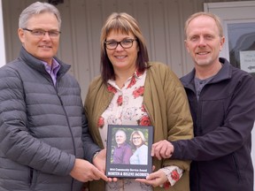 Lucknow Chamber of Commerce president Keith Raymond recently presented the chamber's Community Service Award to Helene and Morten Jakobsen.