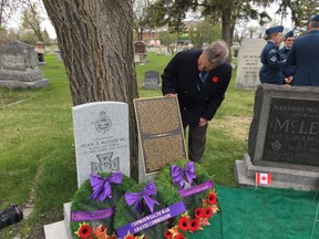Alan Adams inspects the military gravestone and special plaque recognizing his uncle Alan Arnett McLeod VC at the historic Kildonan Church and Cemetery in Winnipeg which was unveiled on Tuesday, May 9, 2017. McLeod was awarded the Victoria Cross for his heroic actions in the First World War and is buried in the Kildonan Church and Cemetery in Winnipeg. He is one of the few Victoria Cross recipients buried in Canada and believed to be the only one who died during the First World War and is buried here. McLeod survived the war but died from the Spanish Influenza on Nov. 6, 1918, five days before the Armstice which ended the First World War.