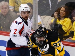 Pittsburgh Penguins' Sidney Crosby holds his face after colliding with Washington Capitals' Matt Niskanen during Game 6 in Pittsburgh on May 8, 2017. (AP Photo/Gene J. Puskar)