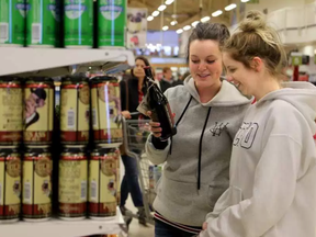 Megan Dowling and Breanna Belway (right) seemed almost giddy at the thought of being able to pick up a couple of craft beers while grocery shopping at the College Square Loblaws on Tuesday, Dec. 15, 2015. JULIE OLIVER / OTTAWA CITIZEN