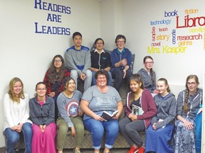 Reading Champion Shelley Davis Forman is shown with her junior high students at Arrowwood Community School. Photo courtesy of Palliser Regional Schools