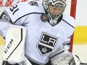 L.A. Kings goalie Ben Bishop stops a shot high on his neck during a game against the Calgary Flames in Calgary on March 29, 2017. (Jim Wells/Postmedia)