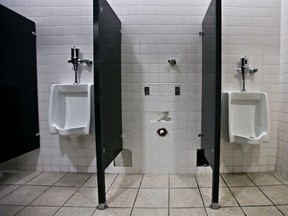 A urinal is missing in a public downtown bathroom in Edmonton, Alta., on Monday, March 24, 2014. Codie McLachlan/Edmonton Sun/QMI Agency
