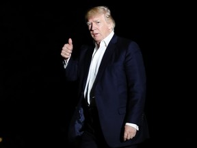 U.S. President Donald Trump walks from Marine One across the South Lawn to the White House in Washington on Sunday, May 7, 2017. (AP Photo/Carolyn Kaster)