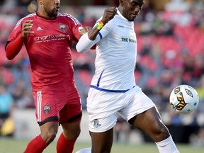 Ottawa's Jamar Dixon tries to get the ball from Edmonton's Papé Diakité during first half action as the Ottawa Fury FC (red) met up with FC Edmonton during the first leg of the Canadian Championship at TD Place in Ottawa Wednesday (May 3, 2017) evening.