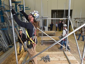 First year student Denny O'Connor setting up scaffolding as the Alberta government announcec funding for the pre-apprenticeship program, Trade Winds to Success Training Society, to help indigenous people pursue construction trade careers at the Alberta Carpenters Training Centre in Edmonton, May 9, 2017. Ed Kaiser/Postmedia