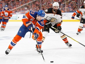 Ryan Nugent-Hopkins #93 of the Edmonton Oilers is pursued by Nate Thompson #44 of the Anaheim Ducks in Game Six of the Western Conference Second Round during the 2017 NHL Stanley Cup Playoffs at Rogers Place on May 7, 2017.