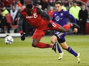Toronto FC forward Jozy Altidore is tripped by an Orlando City player last week. Altidore has started nine of 10 games this season and could be in for some time off tonight in Columbus. (The Canadian Press)