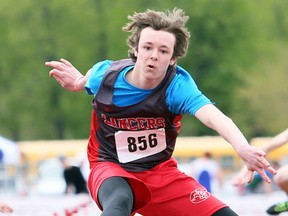 Carson Perry of Lambton Central wins the junior boys' 100-metre hurdles in 15.35 seconds during Day 1 of the LKSSAA track and field championship at the Chatham-Kent Community Athletic Complex in Chatham on Tuesday, May 9, 2017. (MARK MALONE/Postmedia Network)