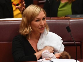 Australian Greens party Sen. Larissa Waters breastfeeds her baby Alia Joy during a session in the Senate Chamber at Parliament House in Canberra, Australia, Tuesday, May 9, 2017. (Mick Tsikas/AAP Image via AP)