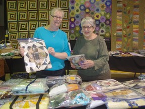 Jean Hillis, right, and Carol Cleator spent Wednesday setting up The Pieces of Magic show in Ingersoll. It runs from Thursday to Saturday at the Ingersoll Arena. (HEATHER RIVERS/WOODSTOCK SENTINEL-REVIEW)