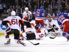 Rick Nash of the New York Rangers jumps over Bobby Ryan of the Ottawa Senators during Game 6 at Madison Square Garden on May 9, 2017. (Bruce Bennett/Getty Images)