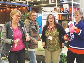 Who says librarians don’t have fun? Ginny Johnson from the Rotary Library (far left) and Leah Sanderson from the Municipal Library (second from right) dance up a storm with two customers at the Canadian Tire Ladies’ Night held on April 30 from 6:30 to 9:30 p.m.