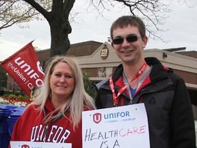 Vision Nursing Home workers Shelly Yates and Nick Smith were among about a dozen people demonstrating outside the Sarnia long-term care home Wednesday. The information picket was calling attention to a demand for better staffing levels. (Tyler Kula/Sarnia Observer)