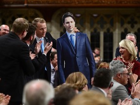 MP Chris Warkentin holds a cardboard cut-out of Prime Minister Justin Trudeau as he stands during a point of order in the House of Commons on Parliament Hill in Ottawa on Tuesday, May 9, 2017. (THE CANADIAN PRESS/Sean Kilpatrick)