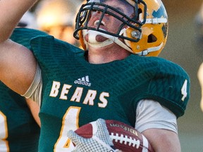 Golden Bears runningback Ed Ilnicki (4) celebrates a touchdown during a football game between the University of Alberta Golden Bears and the Manitoba Bisons at Foote Field in Edmonton, Alta., on Saturday, Oct. 4, 2014.