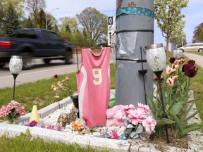 This roadside memorial to Danielle Schmoll, who died after an early morning crash on Oxford Street West in June 2014, is just one of the makeshift tributes that city officials have left untouched around London.  (MIKE HENSEN, The London Free Press)